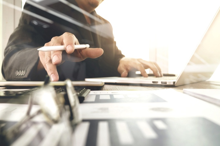 Business owner reviewing a cash flow forecast